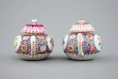 A pair of Chinese famille rose teapots on stand, Yongzheng/Qianlong, 18th C.